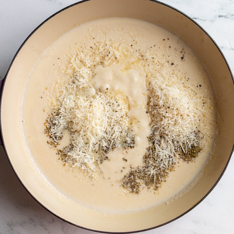 cream sauce in a large skillet before the spices and parmesan has been stirred in