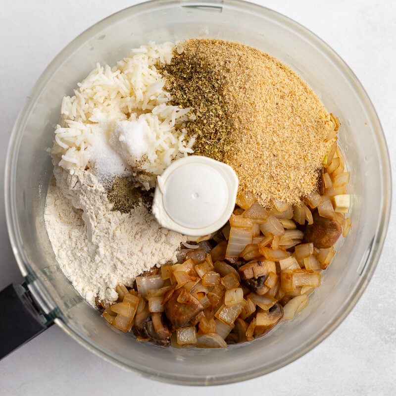 breadcrumbs, flour, cooked veggies, and rice in a food processor before its been blended