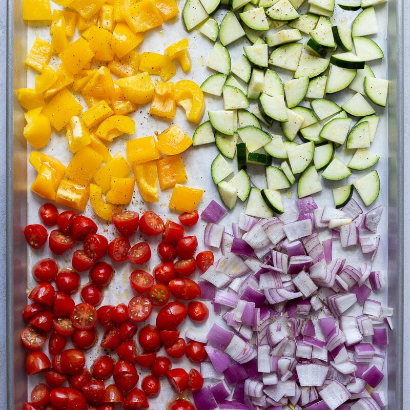 Raw veggies on a baking pan.