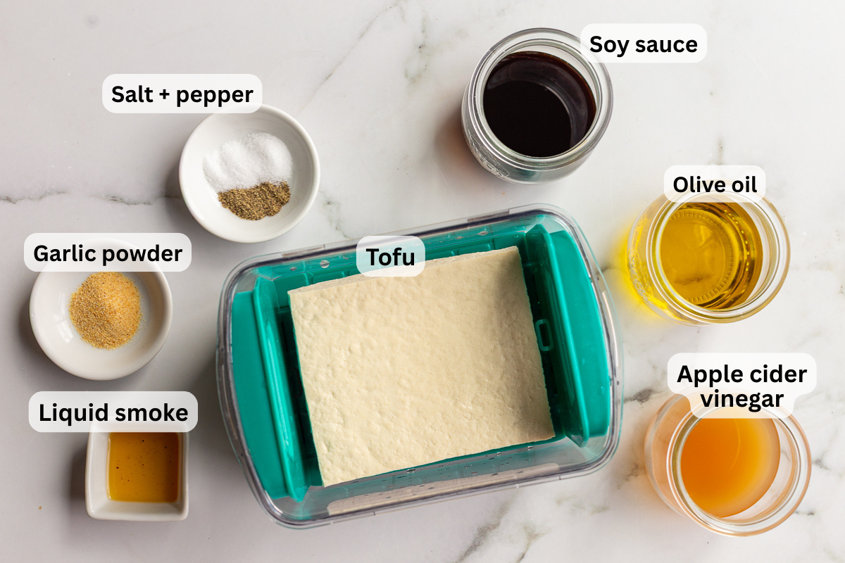 ingredients needed for grilled tofu that are all labeled including tofu, soy sauce, olive oil, apple cider vinegar, garlic powder etc