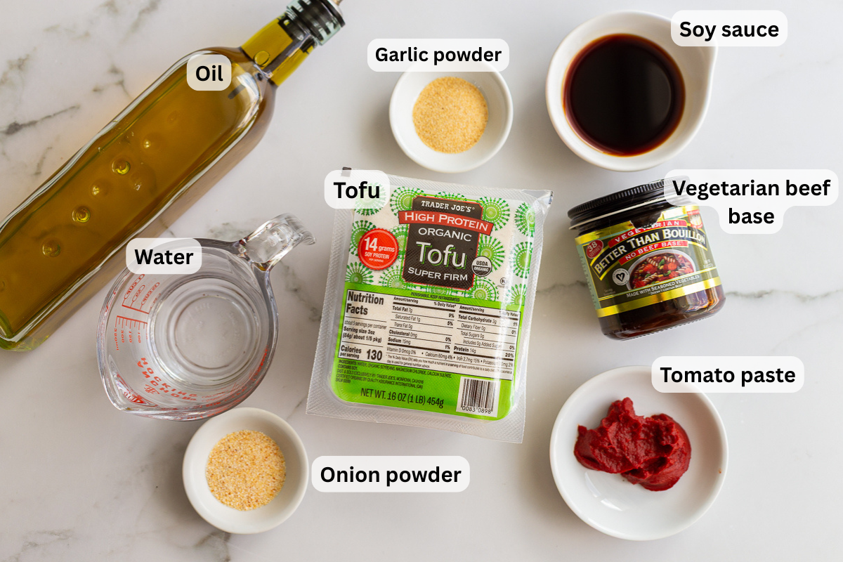 ingredients needed for tofu ground beef including tofu, soy sauce, tomato paste, garlic and onion powder, oil, and beef broth base