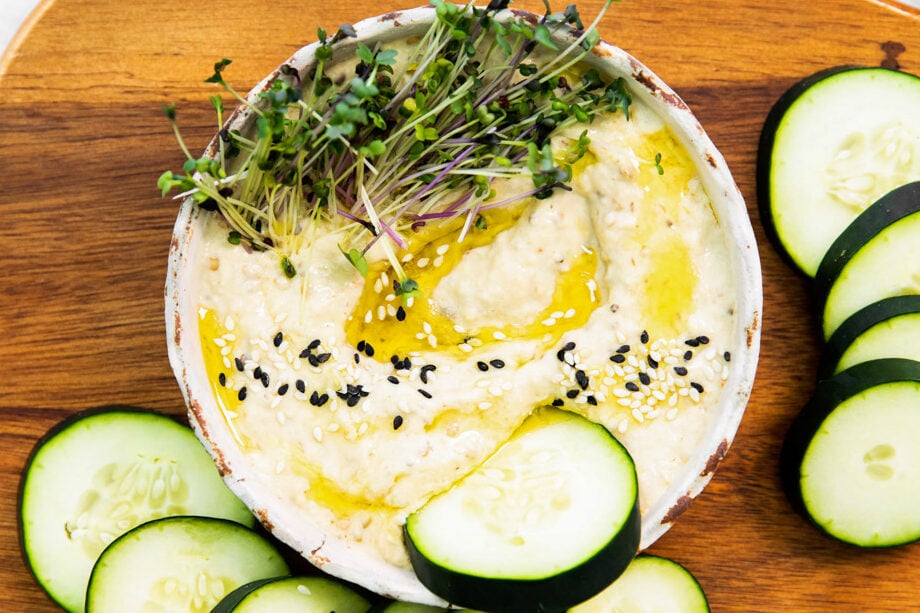 Baba Ganoush with a slice of cucumber dipped in