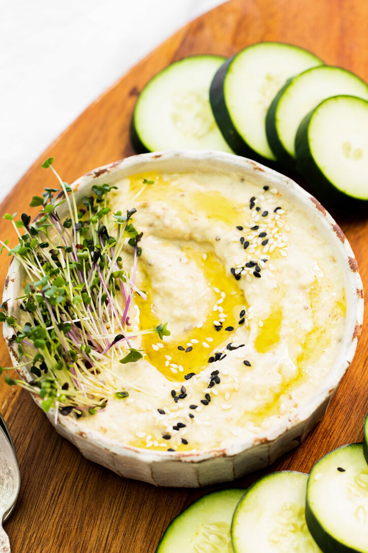 dip drizzled with olive oil and garnished with fresh spouts