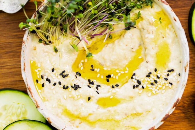 Baba Ganoush dip topped with a drizzle of olive oil and sesame seeds