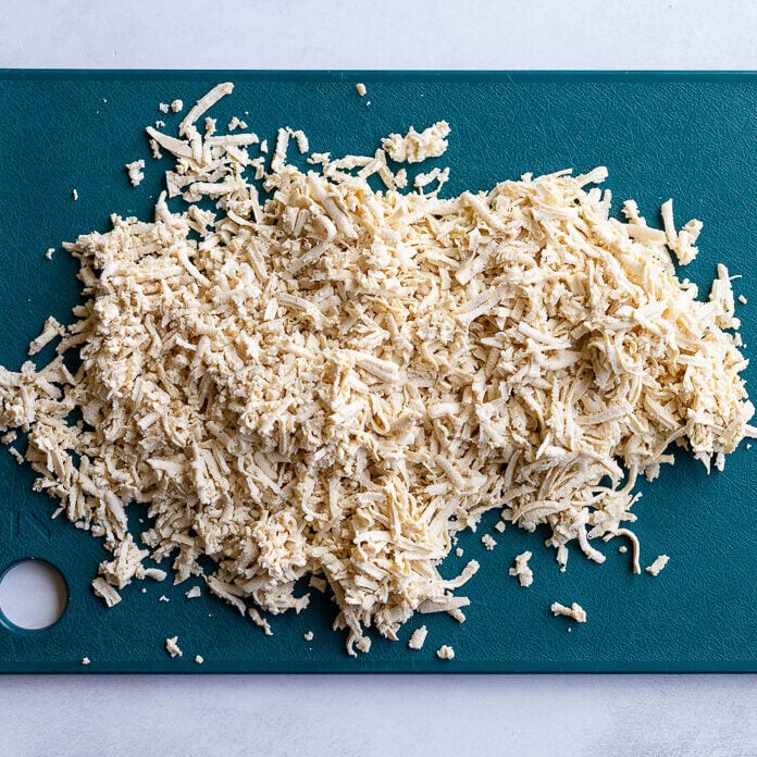shredded tofu on a cutting board