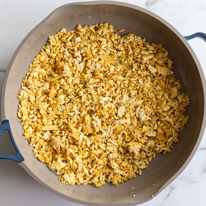 ground tofu crisping up in a skillet