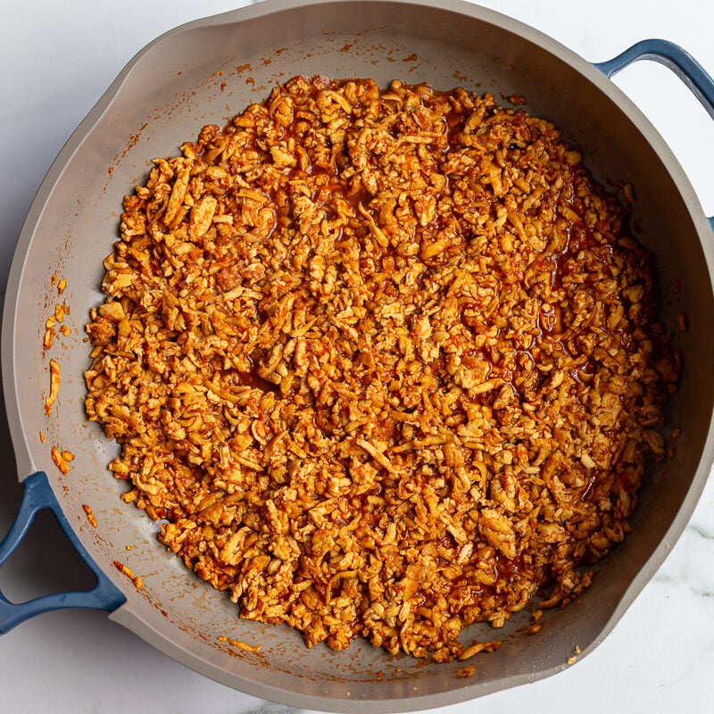 tofu taco meat in a large blue and grey skiller