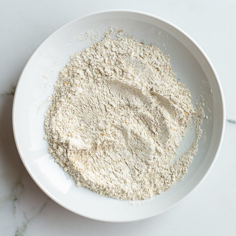 flour and zaatar mixture in a shallow bowl for dredging halloumi fries
