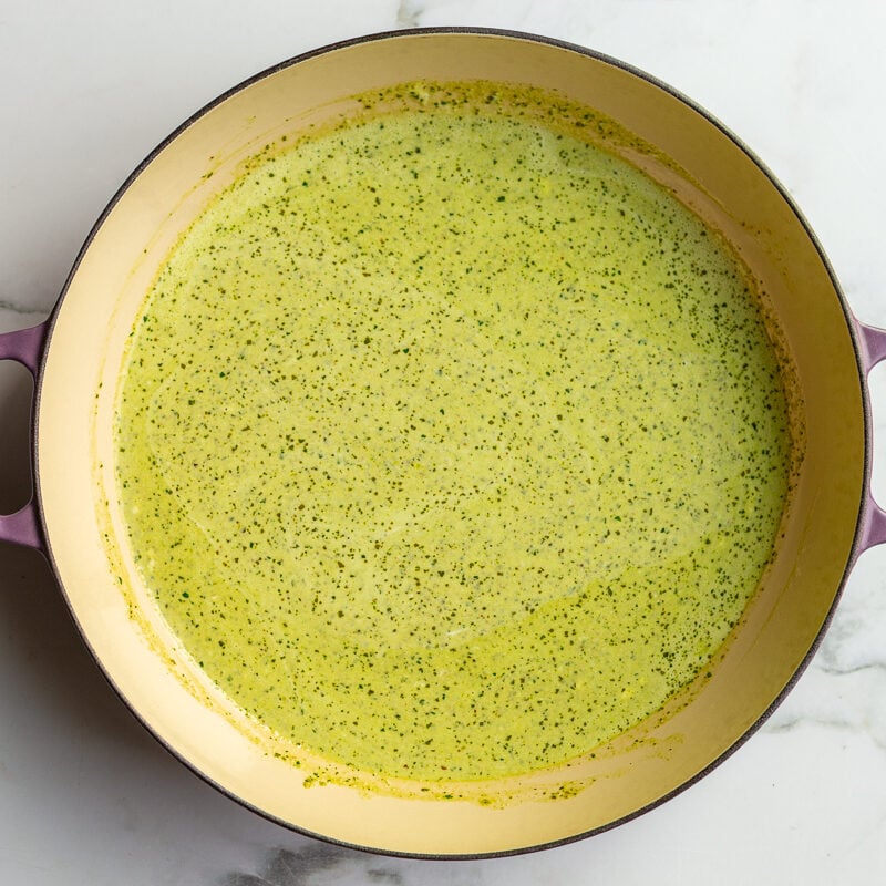 a creamy pesto sauce in a large skillet