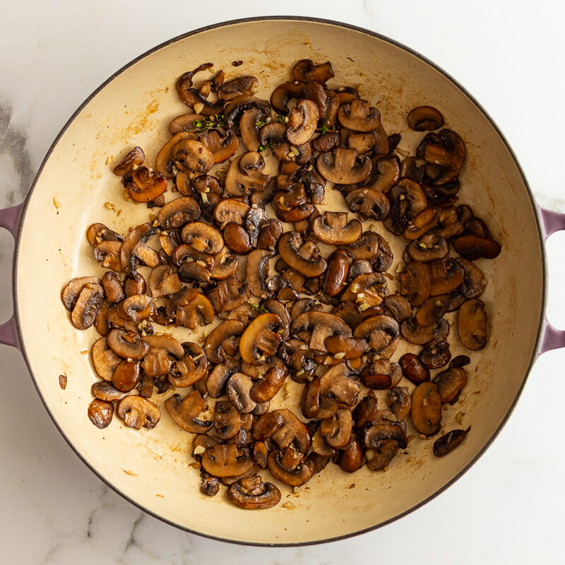 sauteed baby bella mushrooms in a skillet