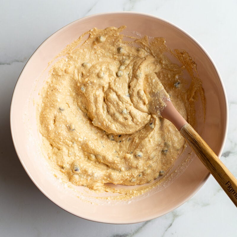 ingredients mixed together in a bowl for greek yogurt bars: peanut butter, yogurt, and mini chocolate chips