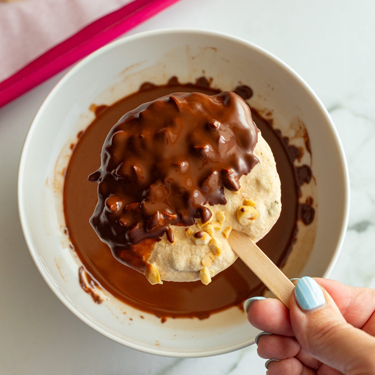 frozen yogurt bars half dipped in melted chocolate