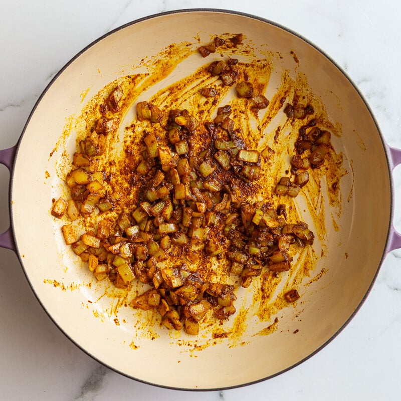 onion and curry spices cooked in a large skillet