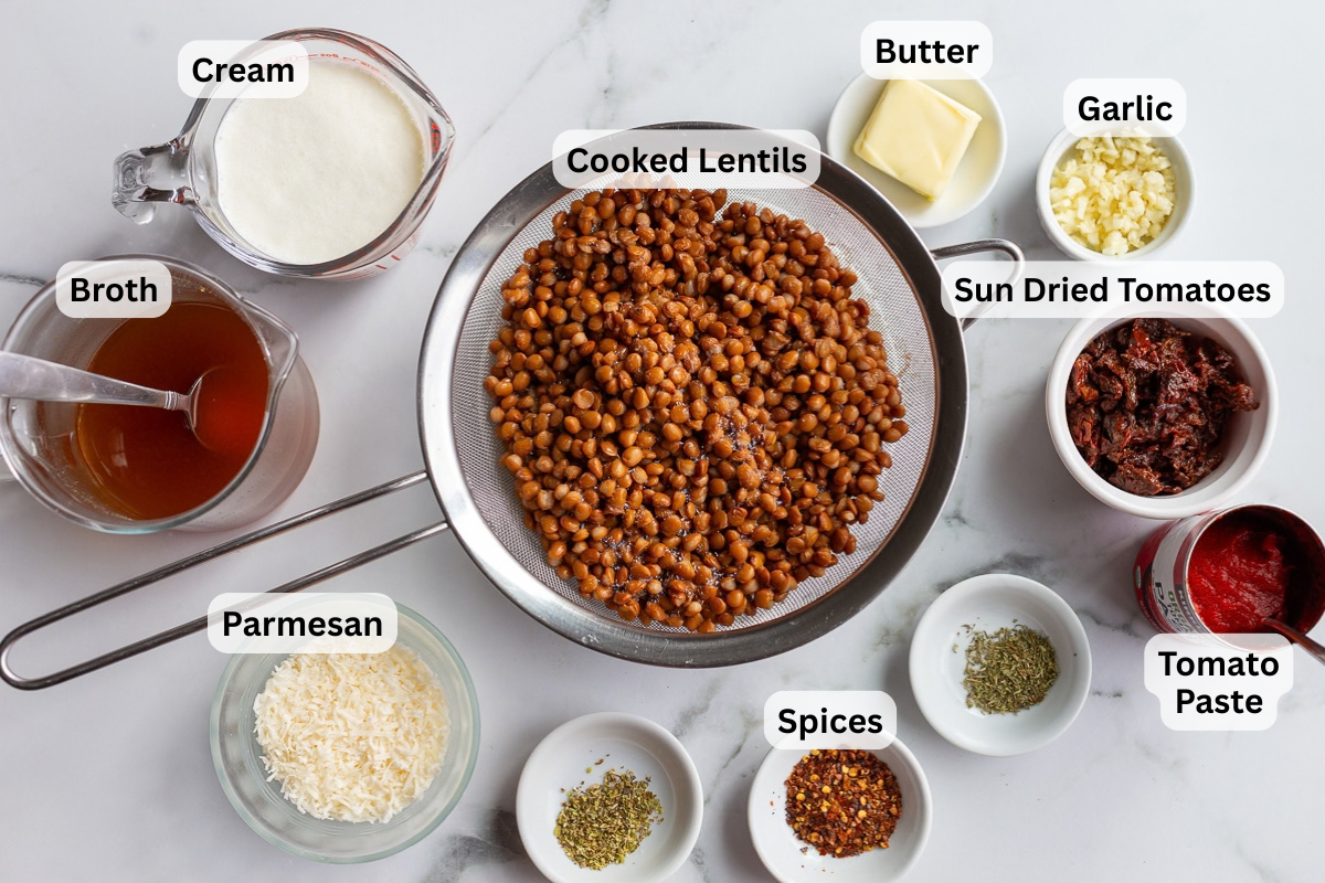 labeled ingredients needed to make marry me lentils including cooked brown lentils, broth, cream, parmesan, spices, sun dried tomatoes, tomato paste, and butter