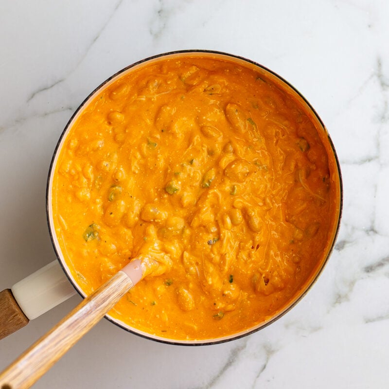 buffalo sauce heated up in a white pot