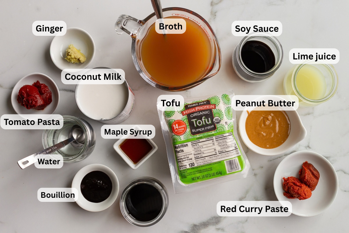 labeled ingredients needed to make broth bowls including broth, tofu, peanut butter, soy sauce, ginger etc