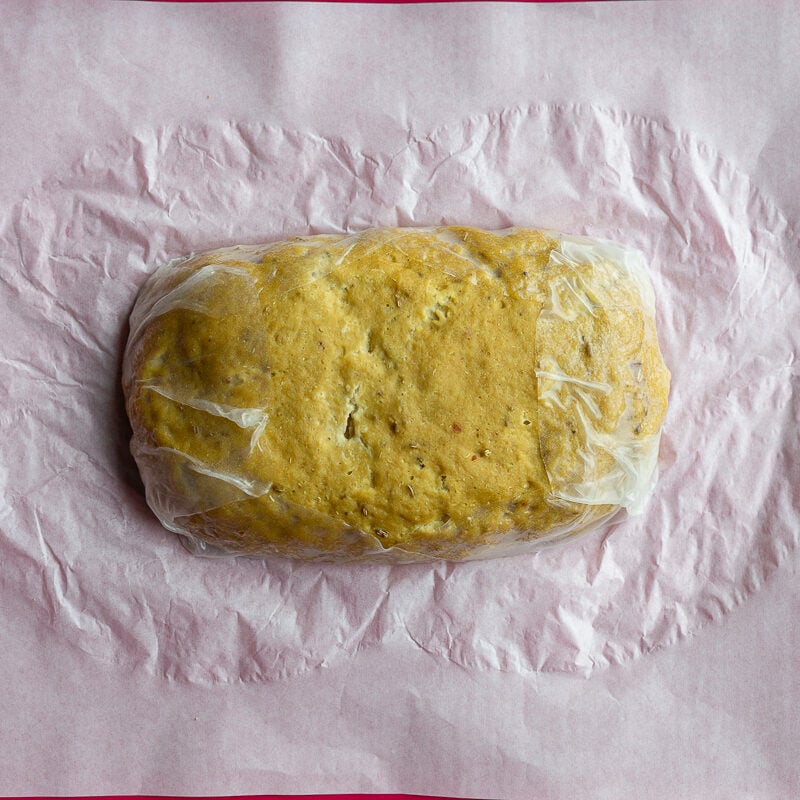 seitan loaf laying on top of rice paper
