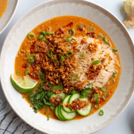 creamy vegetarian broth bowls with rice, tofu mince, and cucumbers