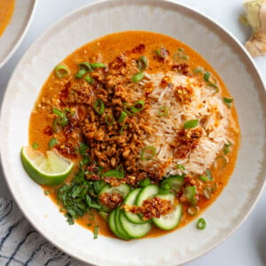 creamy vegetarian broth bowls with rice, tofu mince, and cucumbers