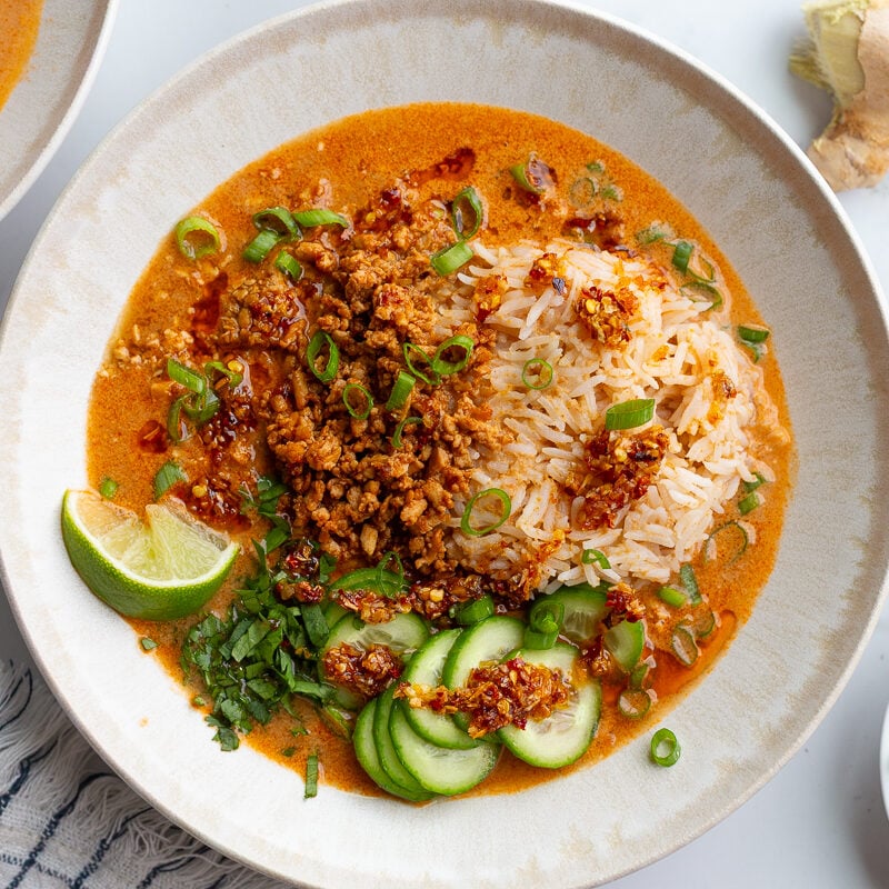 creamy vegetarian broth bowls with rice, tofu mince, and cucumbers