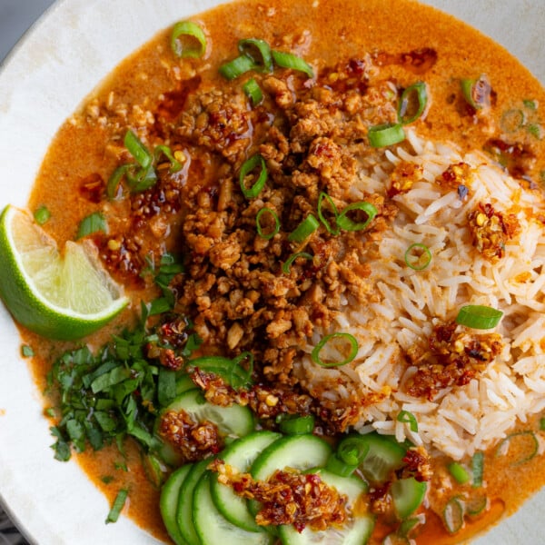 creamy vegetarian broth bowls with rice, tofu mince, and cucumbers