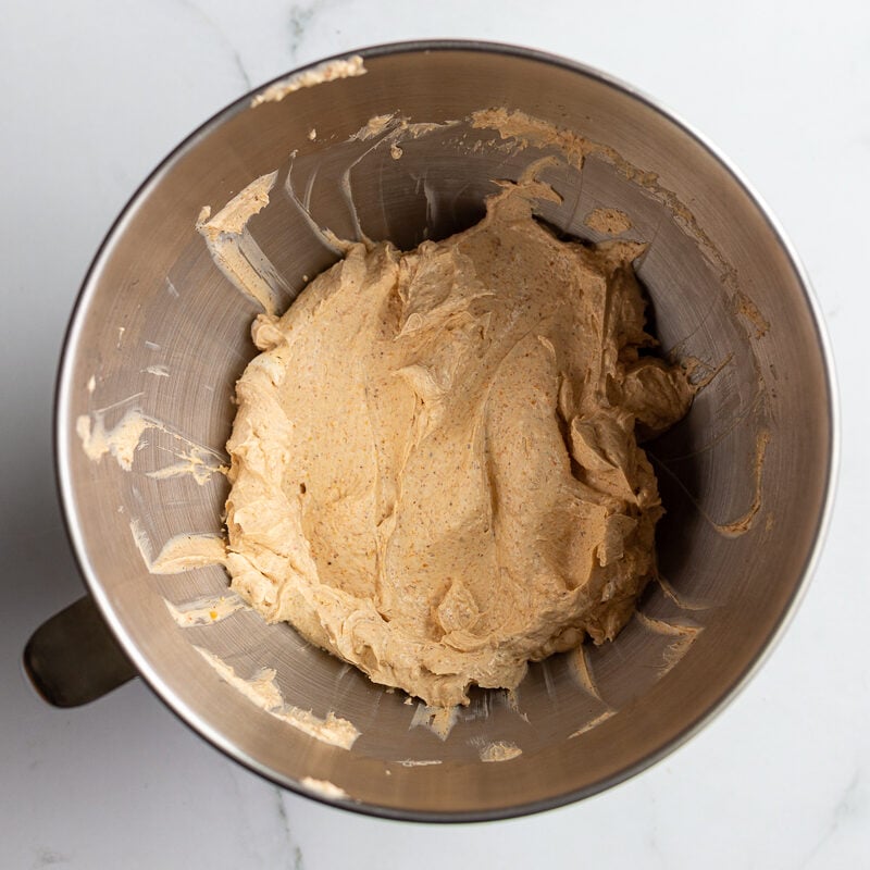 cream cheese and taco seasoning creamed together in a stand mixer bowl