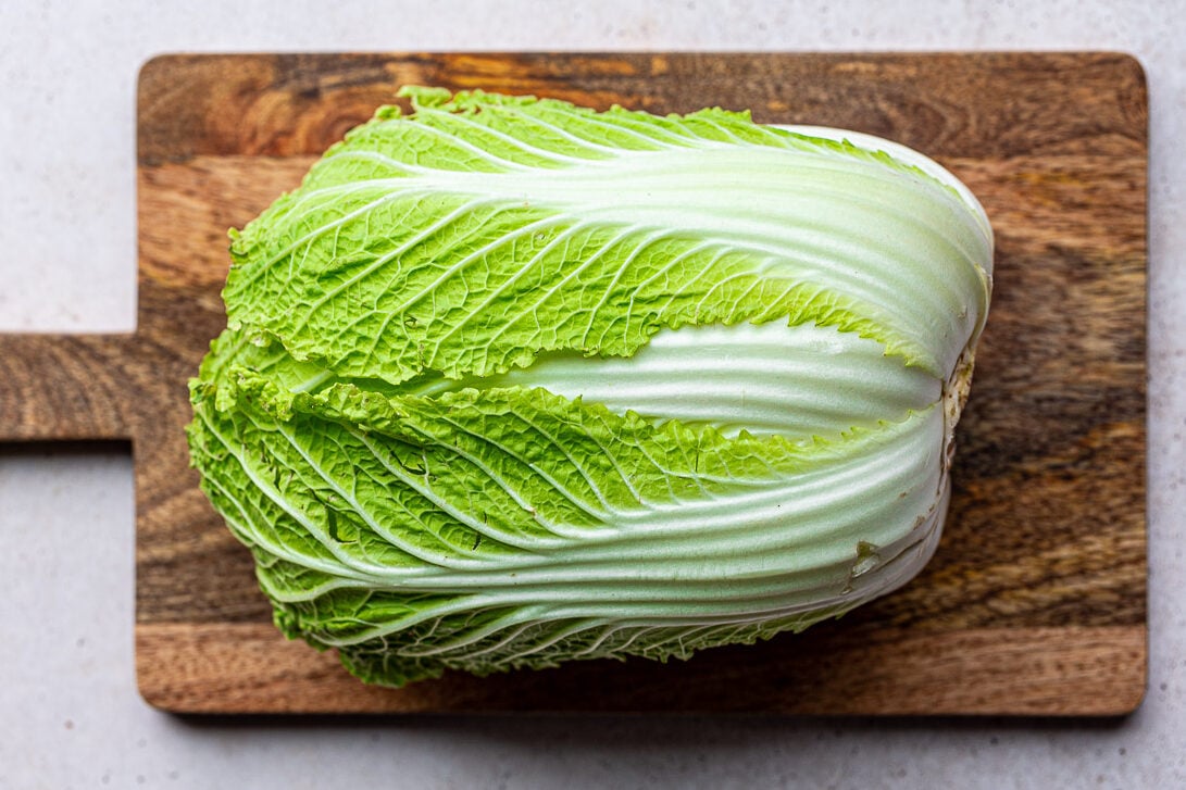 Fresh Napa cabbage on a cutting board.