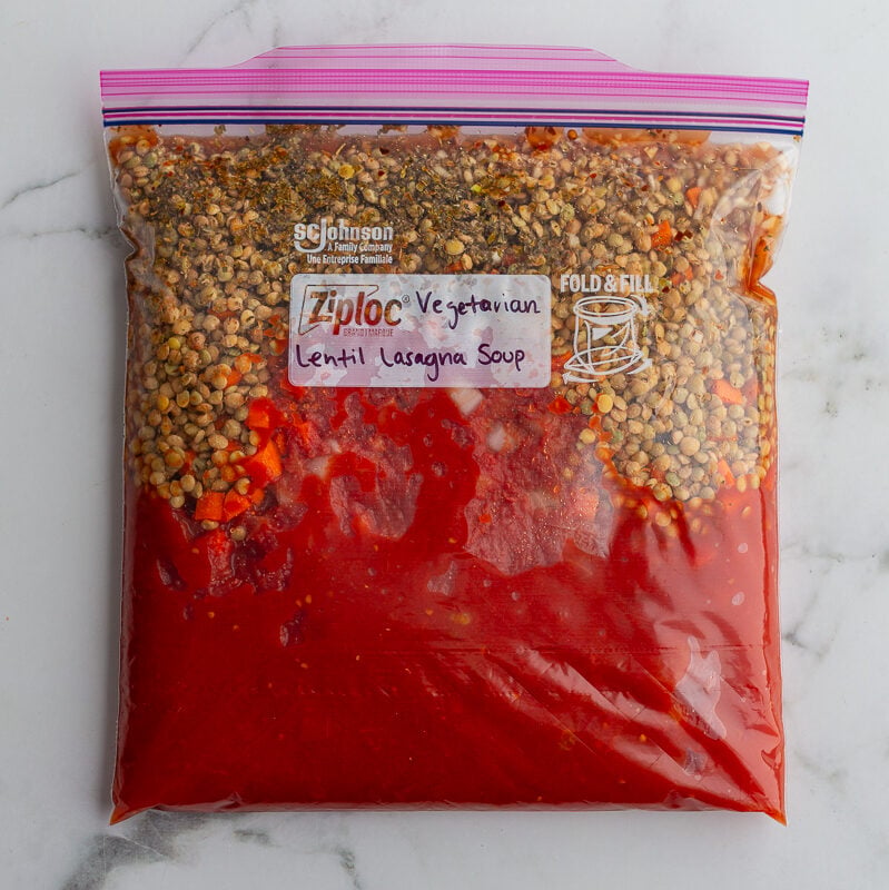 freezer bag labeled "Vegetarian Lentil Lasagna Soup" with ingredients inside to make that recipe