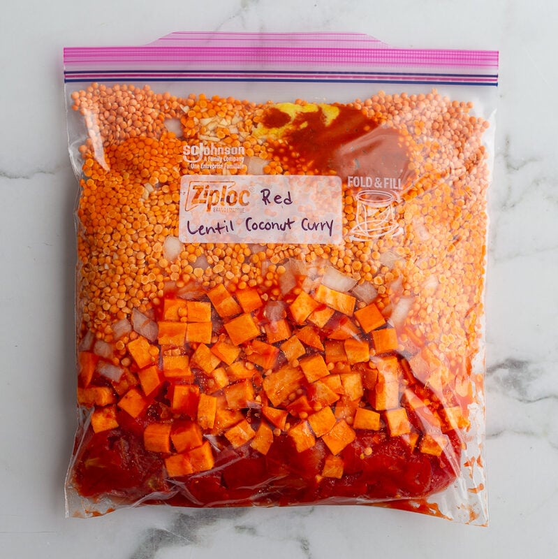 labeled freezer bag for "Red Lentil Coconut Curry" with ingredients for the recipe inside