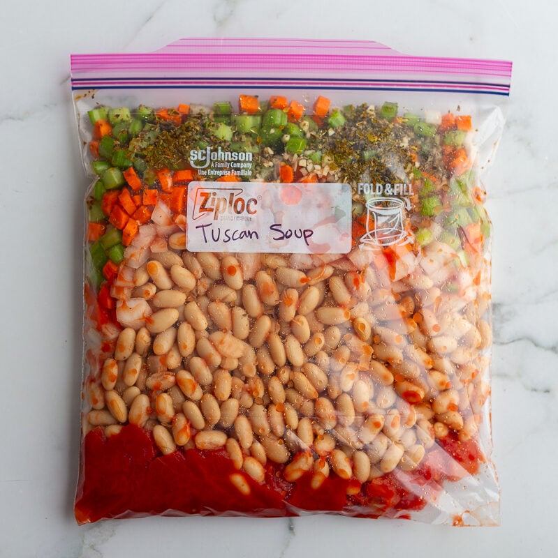 freezer bag labeled "White Bean and Kale Tuscan Soup" with ingredients to make White Bean and Kale Tuscan Soup