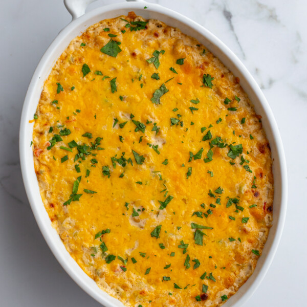 cream cheese corn dip in an oval dish