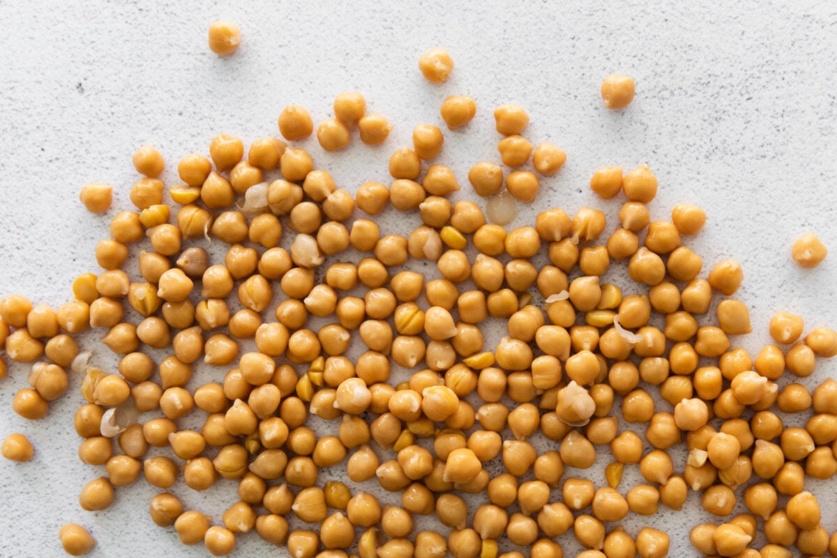 cooked chickpeas spilled out on a tabletop